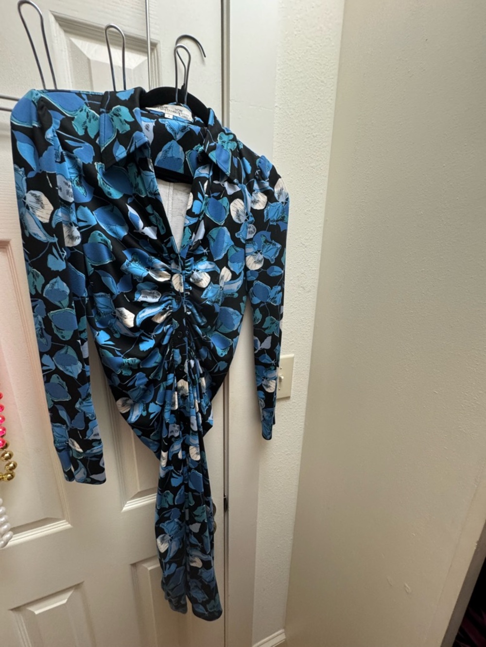 Diane Von Furstenberg Black Top with Vibrant Blue Floral Print